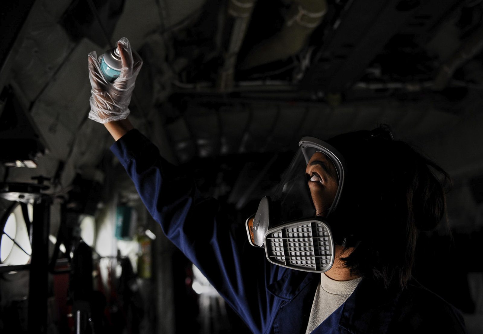 Pest-control technician treating a home